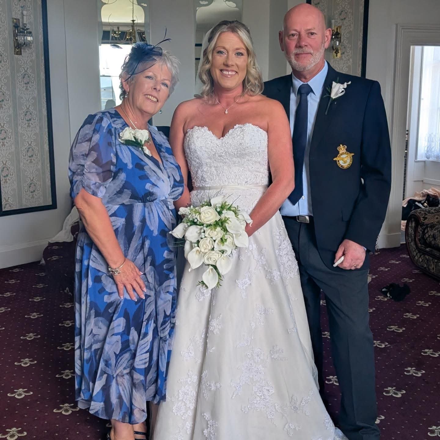 Bride with family members, all styled for the wedding celebration