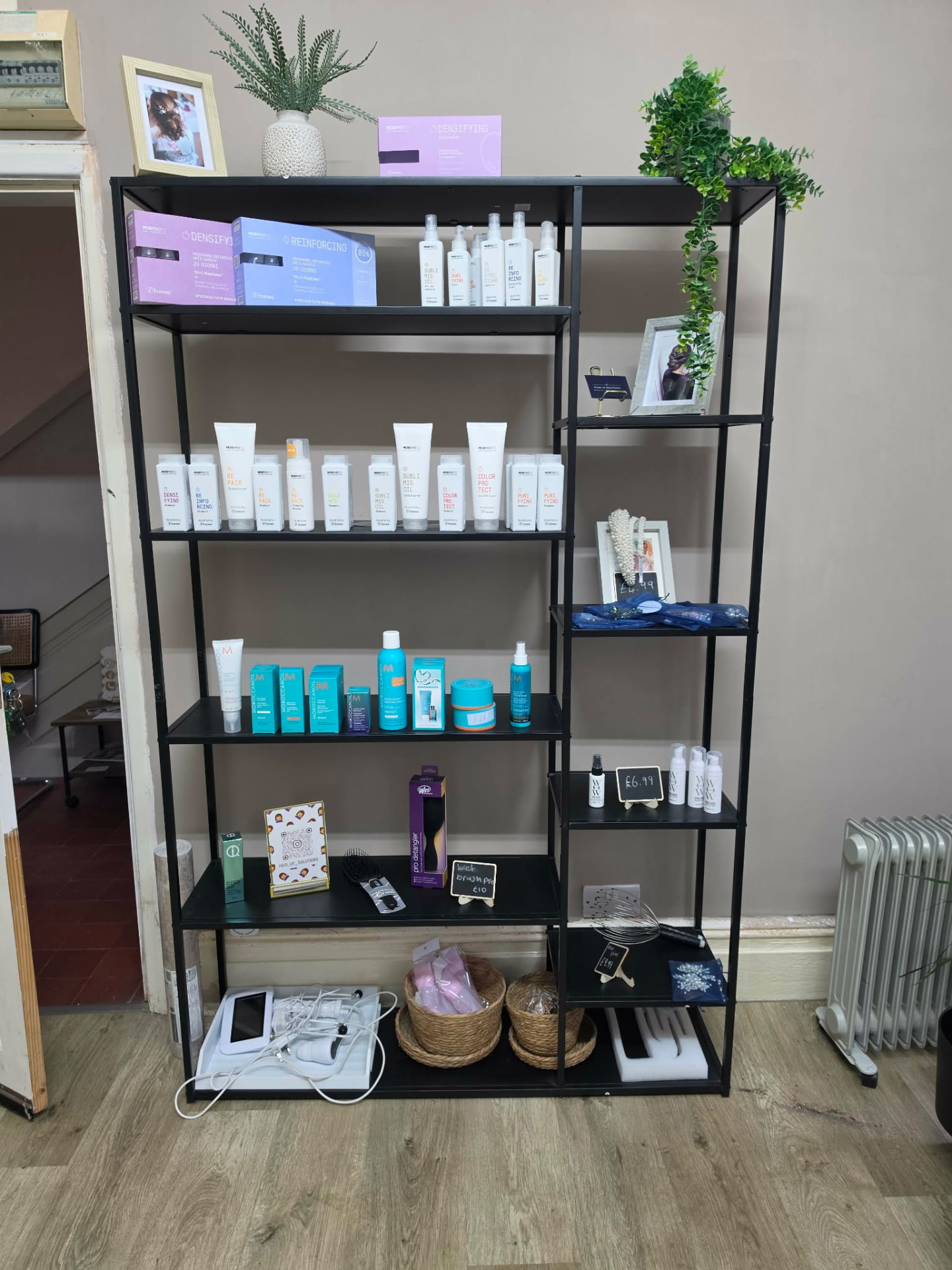 Retail shelves of professional haircare products inside Mortimer Hair House